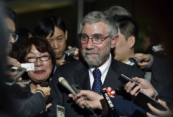 epa05225318 US economist and Nobel Prize winner Paul Krugman reacts to questions from journalists after his meeting with Japanese Prime Minister Shinzo Abe at Abe&#039;s official residence in Tokyo, J ...