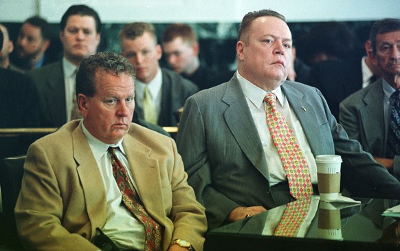 FILE - &quot;Hustler&quot; magazine publisher Larry Flynt, right, and his brother Jimmy listen to the judge pass sentence after agreeing to a plea bargain with prosecutors in Hamilton County Court on  ...