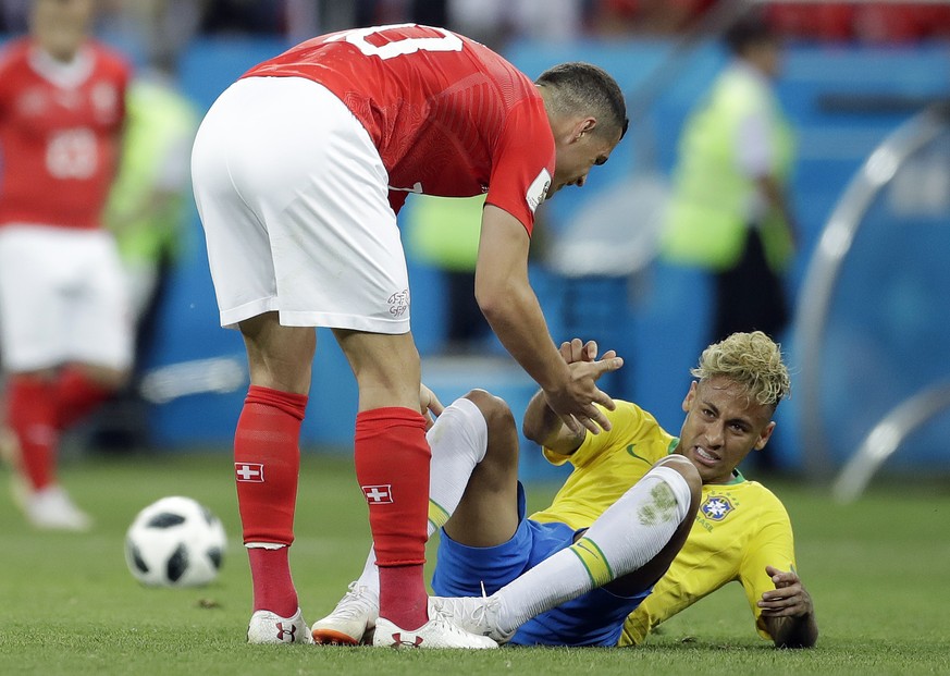 Switzerland&#039;s Granit Xhaka, left, helps Brazil&#039;s Neymar during the group E match between Brazil and Switzerland at the 2018 soccer World Cup in the Rostov Arena in Rostov-on-Don, Russia, Sun ...