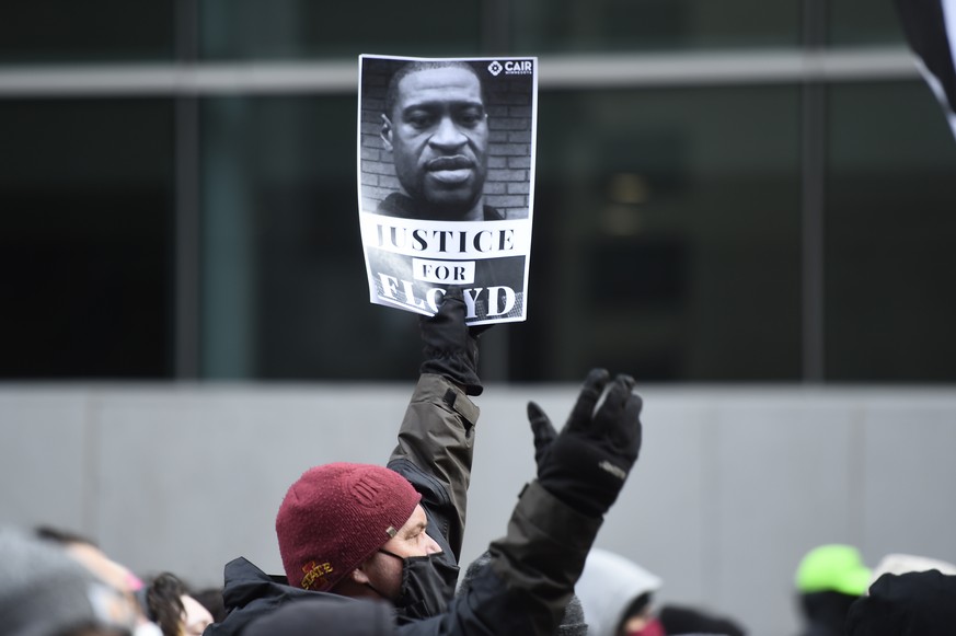 epa09146428 Protesters march through the streets after attorneys finished closing arguments and the jury began deliberations for the murder trial of former Minneapolis police officer Derek Chauvin who ...