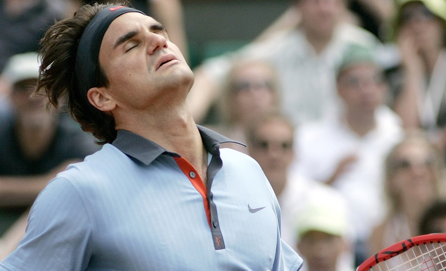 Switzerland&#039;s Roger Federer reacts after missing a point against Germany&#039;s Tommy Haas during their fourth round match of the French Open tennis tournament at the Roland Garros stadium in Par ...