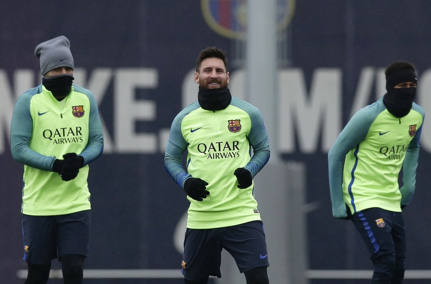 From Left to right FC Barcelona&#039;s Luis Suarez, Lionel Messi and Neymar exercise during a training session at the Sports Center FC Barcelona Joan Gamper in Sant Joan Despi, Spain, Wednesday, Jan.  ...