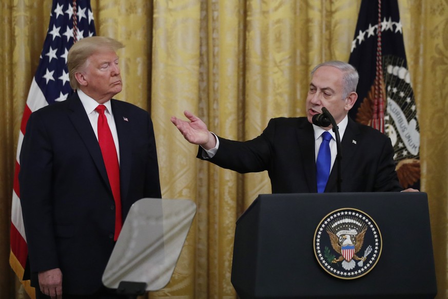 Israeli Prime Minister Benjamin Netanyahu speaks during an event with President Donald Trump in the East Room of the White House in Washington, Tuesday, Jan. 28, 2020, to announce the Trump administra ...