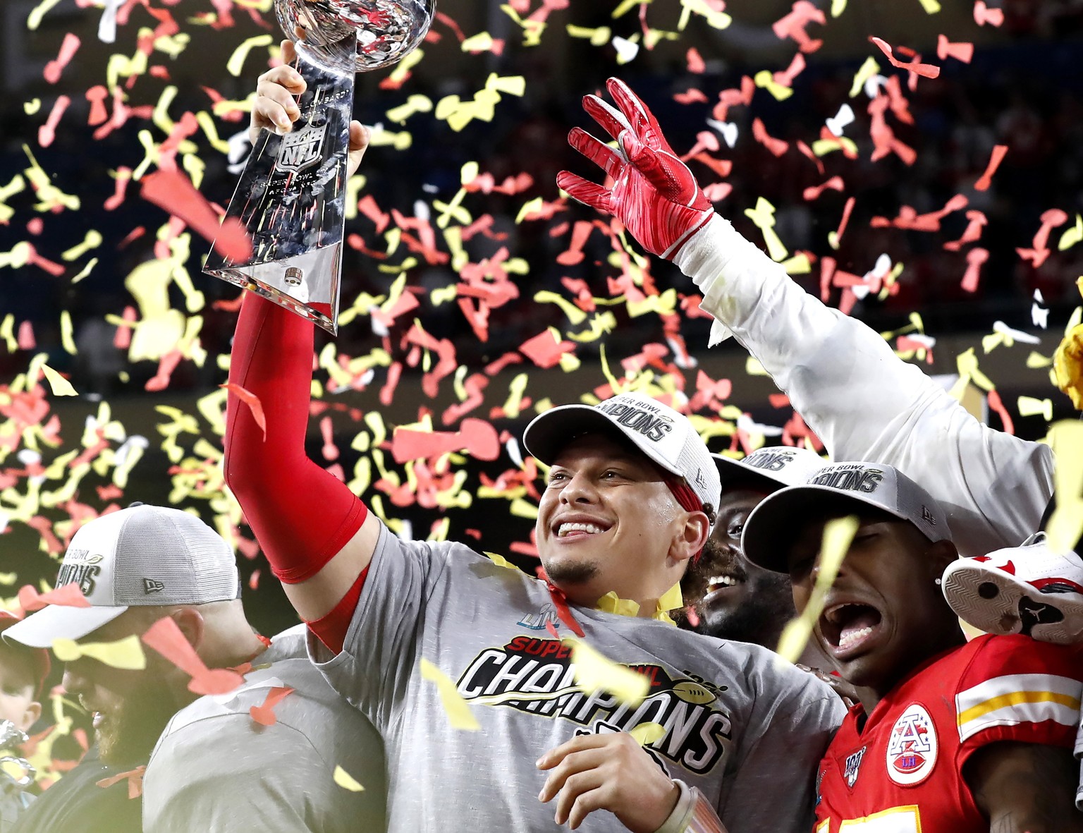 epa08189792 Kansas City Chiefs quarterback Patrick Mahomes hoists the Vince Lombardi Trophy after defeating the San Francisco 49ers to win the National Football League Super Bowl LIV at Hard Rock Stad ...
