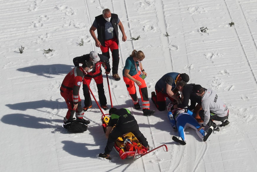 epa09096307 Daniel Andre Tande of Norway receives medical attention after falling during a trial round of the Large Hill individual competition of the FIS Ski Jumping World Cup in Planica, Slovenia, 2 ...