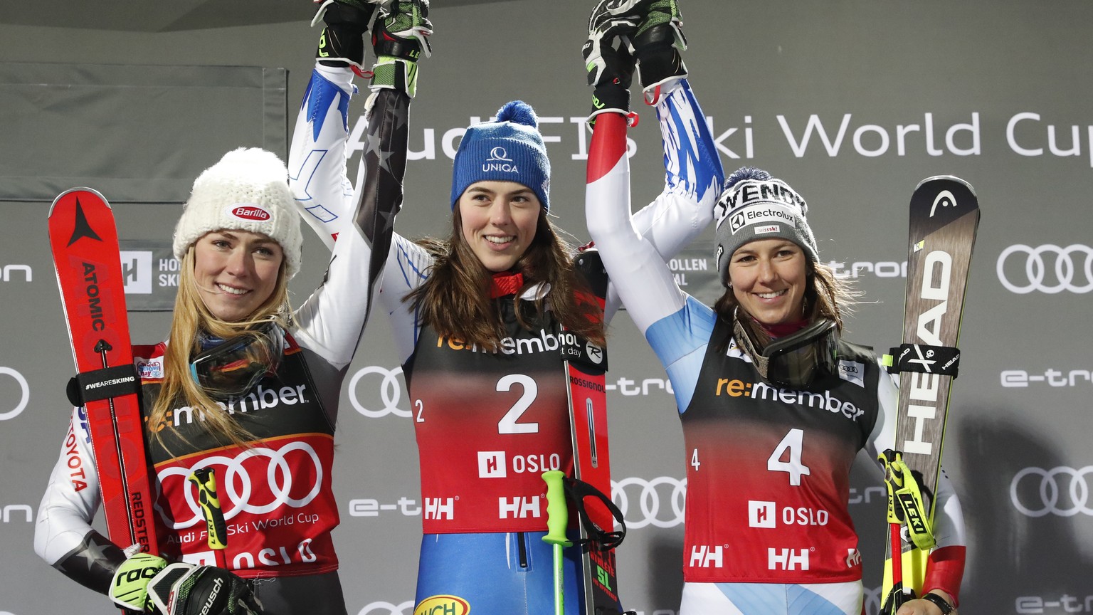 Slovakia&#039;s Petra Vlahova, center, winner of an alpine ski, women&#039;s World Cup parallel slalom, poses on the podium with second placed Mikaela Shiffrin, of the United States, left, and third p ...