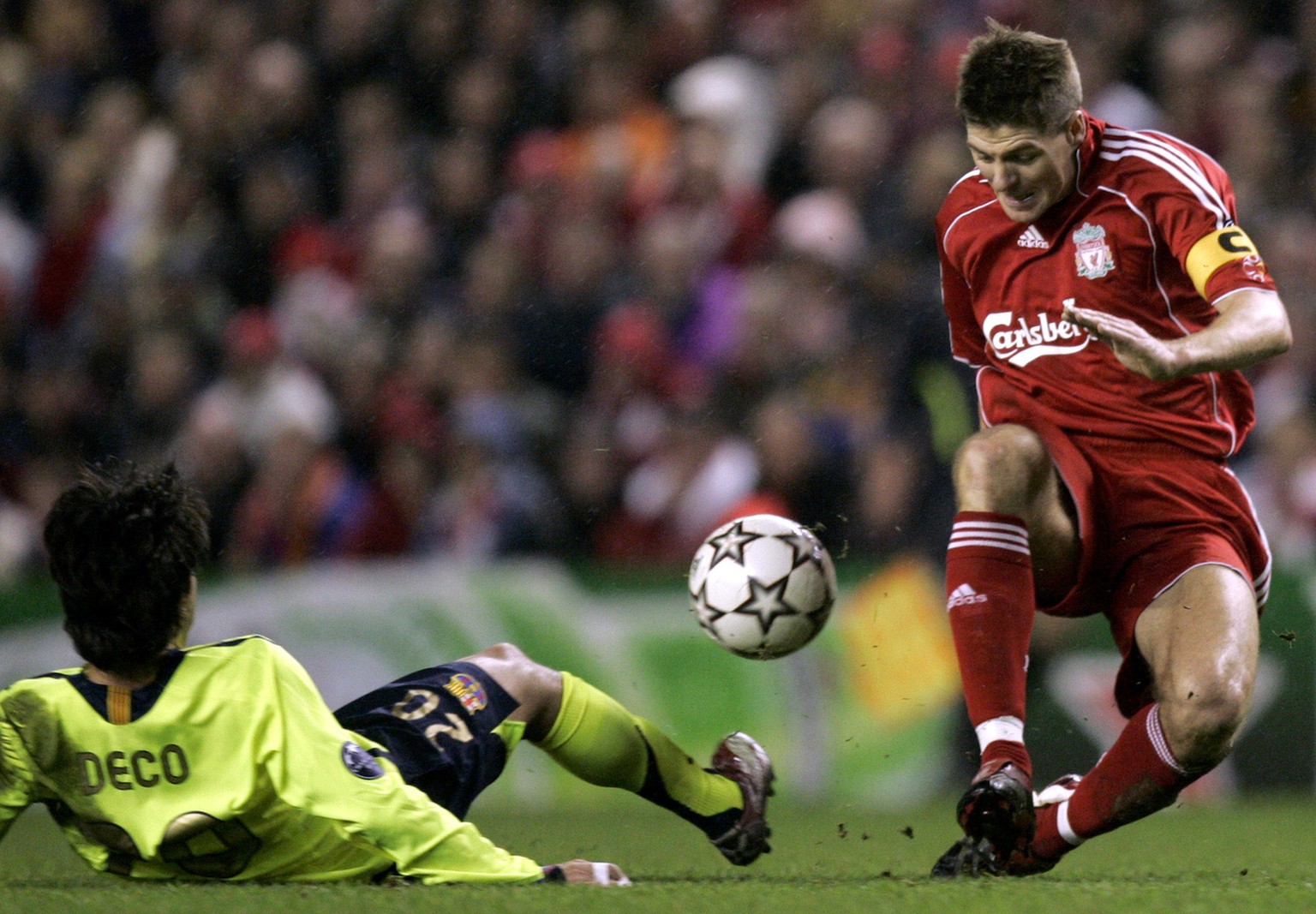 Liverpool&#039;s Steven Gerrard, right, is tackled by Barcelona&#039;s Deco during their Champion&#039;s League first knockout round, second leg soccer match, in Liverpool, England, Tuesday March 6, 2 ...