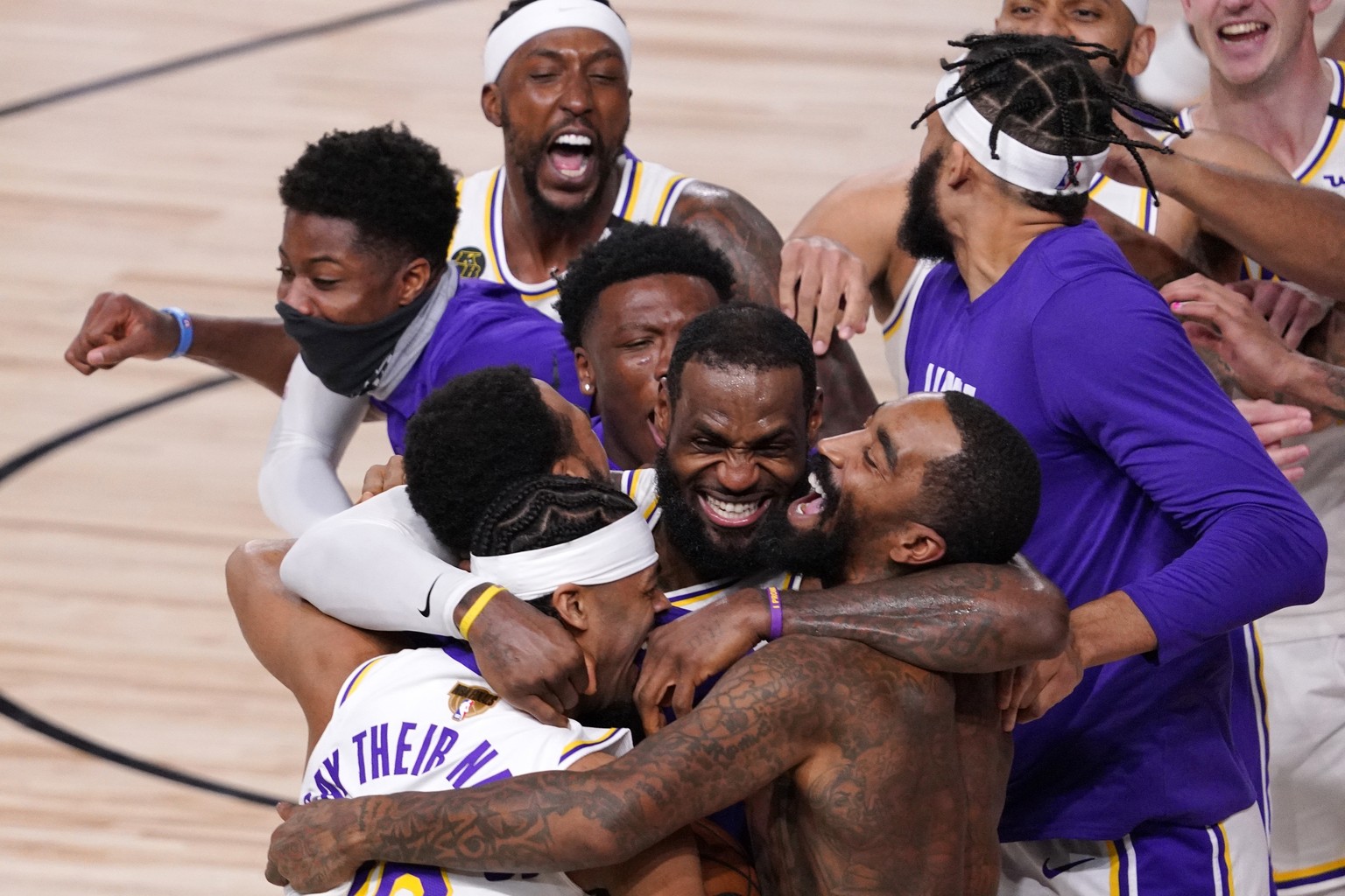 Los Angeles Lakers&#039; LeBron James (23) celebrates with his teammates after the Lakers defeated the Miami Heat 106-93 in Game 6 of basketball&#039;s NBA Finals Sunday, Oct. 11, 2020, in Lake Buena  ...