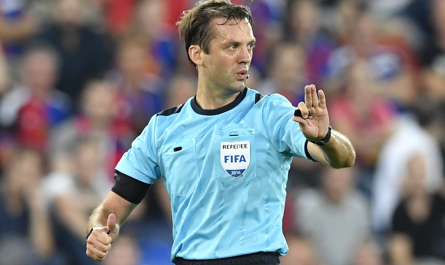 Referee Aleksei Kulbakov of Belarus reacts during an UEFA Champions League Group stage Group A matchday 1 soccer match between Switzerland&#039;s FC Basel 1893 and Bulgaria&#039;s PFC Ludogorets Razgr ...