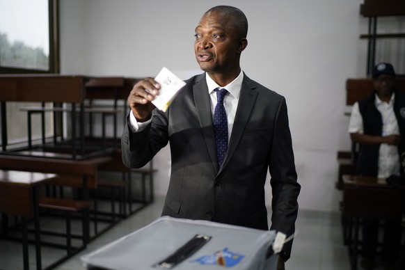 Ruling party presidential candidate Emmanuel Ramazani Shadary casts his vote Sunday, Dec. 30, 2018 in Kinshasa, Congo. Forty million voters are registered for a presidential race plagued by years of d ...