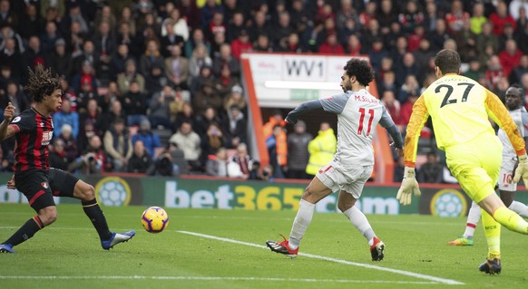 Liverpool&#039;s Mohamed Salah, right, scores his hat-trick goal during their English Premier League soccer match against Bournemouth at the Vitality Stadium, Bournemouth, England, Saturday, Dec. 8, 2 ...