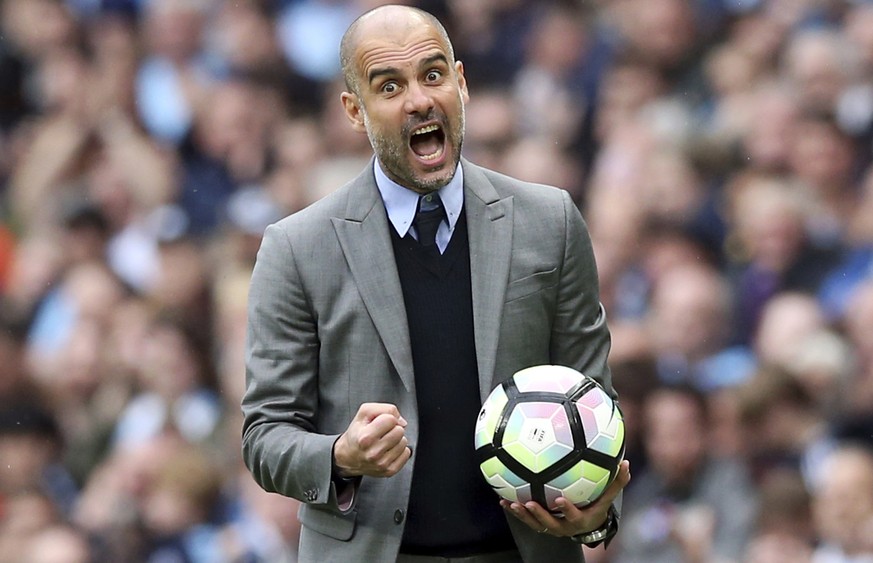 Manchester City manager Pep Guardiola gestures on the touchline, during the English Premier League soccer match between Manchester City and Leicester, at the Etihad Stadium, in Manchester, England, Sa ...