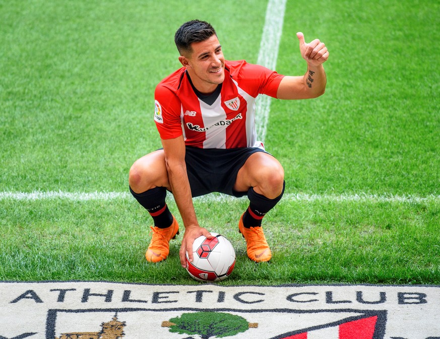 epa06867866 Athletic Bilbao&#039;s new Spanish player Yuri Berchiche poses for photographers during his presentation at the San Mames stadium in Bilbao, Spain, 06 July 2018. Berchiche joined Athletic  ...