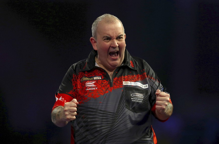 England&#039;s Phil Taylor after winning against his opponent Wales&#039; Jamie Lewis, in the semifinals of the World Darts Championship at Alexandra Palace, London, Saturday Dec. 30, 2017. (Steven Pa ...