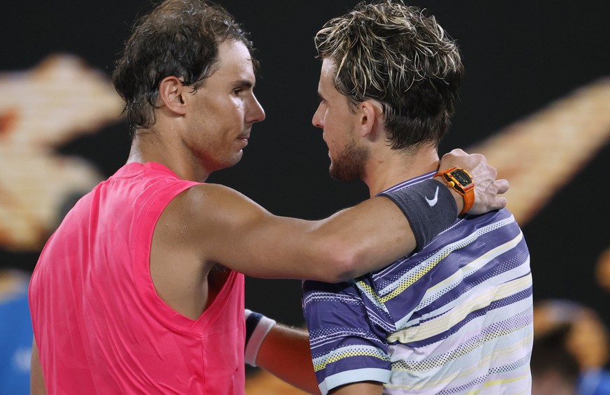 Austria&#039;s Dominic Thiem, right, is congratulated by Spain&#039;s Rafael Nadal after winning their quarterfinal match at the Australian Open tennis championship in Melbourne, Australia, Wednesday, ...