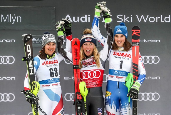 epa07424645 (L-R) Second placed Wendy Holdener of Switzerland, first placed Mikaela Shiffrin of US and third placed Petra Vlhova of Slovakia celebrate on the podium during trophy ceremony of Women&#03 ...