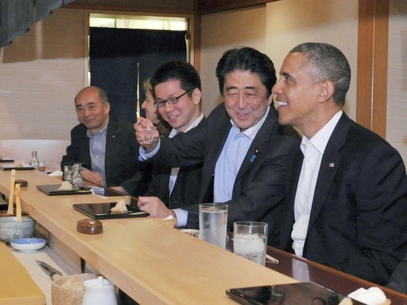 In this photo taken Wednesday, April 23, 2014 and released by Japan&#039;s Cabinet Public Relations Office, Japanese Prime Minister Shinzo Abe, second right, shares a laugh with U.S. President Barack  ...