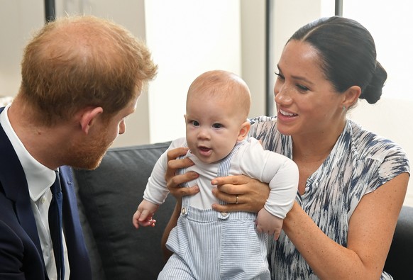 epa08348531 (FILE) - Britain&#039;s Prince Harry (L), The Duke of Sussex and his wife Meghan, Duchess of Sussex, holding their son Archie during a visit to the Desmond &amp; Leah Tutu Legacy Foundatio ...