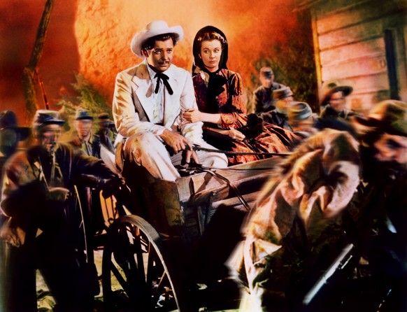 In this image released by Turner Classic Movies, Clark Gable, left, appears as Rhett Butler, and Vivien Leigh as Scarlett O&#039;Hara in a scene from the film, &quot;Gone with the Wind.&quot; 75 years ...