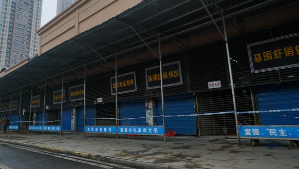 The Wuhan Huanan Wholesale Seafood Market, where a number of people related to the market fell ill with a virus, sits closed in Wuhan, China, Tuesday, Jan. 21, 2020. Heightened precautions were being  ...