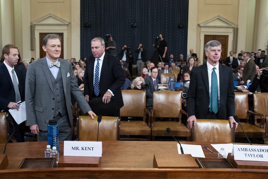 epa07993835 Charge d&#039;Affaires at the US embassy in Ukraine Bill Taylor (R) testifies beside Deputy Assistant Secretary of State for Europe and Eurasia George Kent (L) return from a break during t ...
