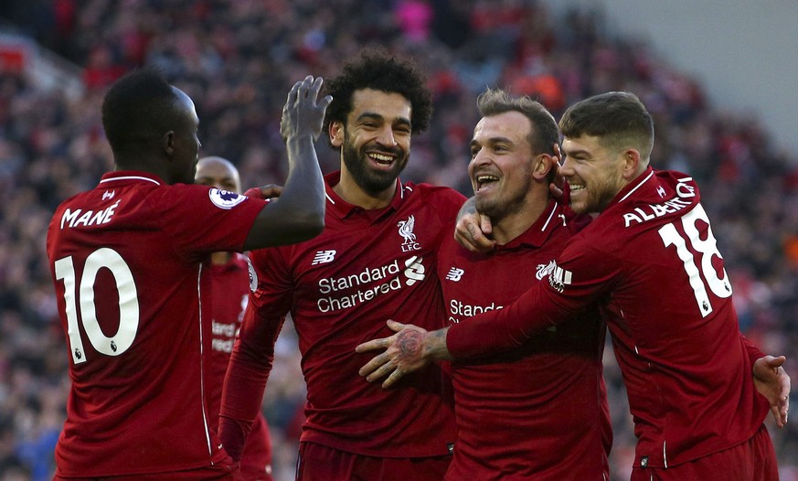 Liverpool&#039;s Xherdan Shaqiri, second right, celebrates scoring his side&#039;s third goal of the game with Sadio Mane,left, Mohamed Salah and Alberto Moreno during the English Premier League socce ...