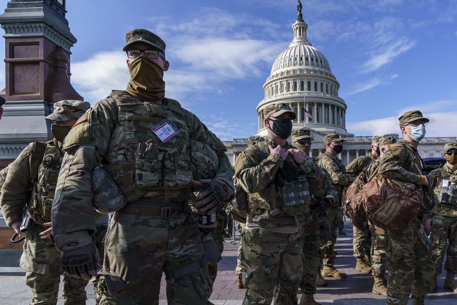 National Guard troops reinforce security around the U.S. Capitol ahead of expected protests leading up to President-elect Joe Biden&#039;s inauguration, in Washington, Sunday, Jan. 17, 2021, following ...
