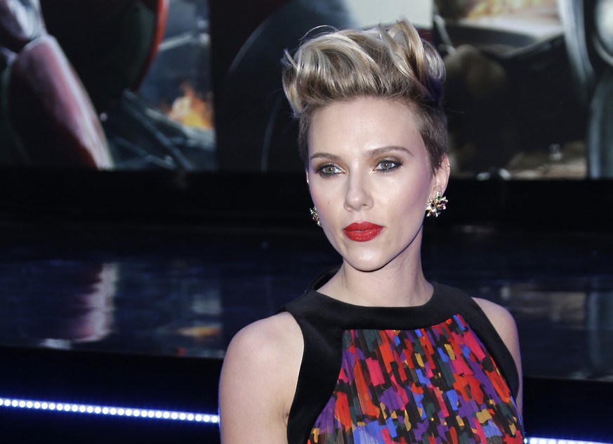 FILE - In this April 21, 2015, file photo, Scarlett Johansson poses for photographers upon arrival at the premiere for the film &#039;The Avengers Age of Ultron&#039; in London. Box Office Mojo has cr ...