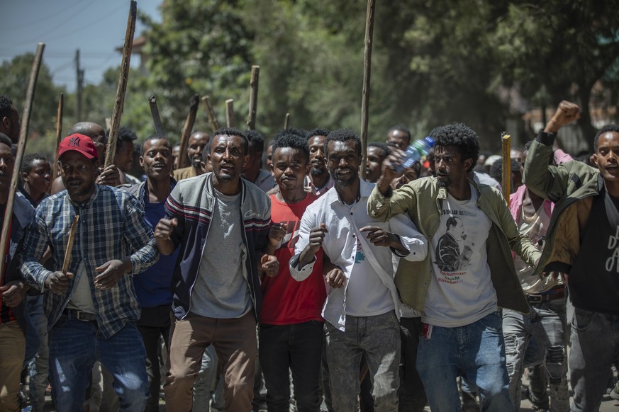 A group of supporters perform and shout slogans at the house of opposition leader Jawar Mohammed to show their support, in Addis Ababa, Ethiopia, Thursday Oct. 24, 2019. EthiopiaÄôs Nobel Peace Prize ...