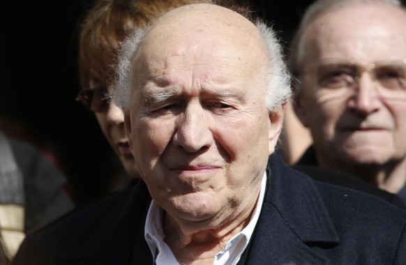 French actor Michel Piccoli leaves after the funeral ceremony of late film director Alain Resnais at the Saint-Vincent-de-Paul church in Paris March 10, 2014. Filmmaker Resnais, known for classics suc ...