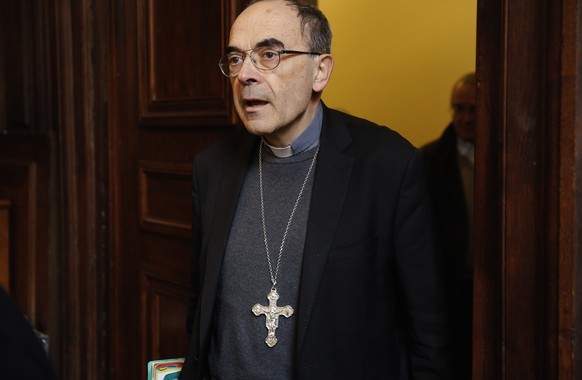 epa08178637 (FILE) Cardinal Philippe Barbarin arrives for a press conference after being convicted of helping covering up sex abuse and being handed a six-month suspended jail term at the Maison du Di ...