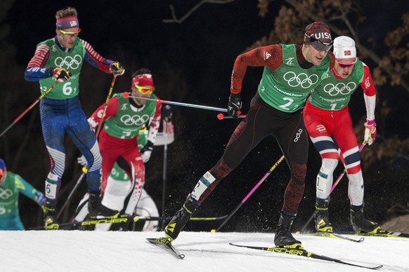 Simeon Hamilton of the United States, Alex Harvey of Canada, Dario Cologna of Switzerland and Johannes Hoesflot Klaebo of Norway, from left, in action during the men Cross-Country Skiing team sprint f ...