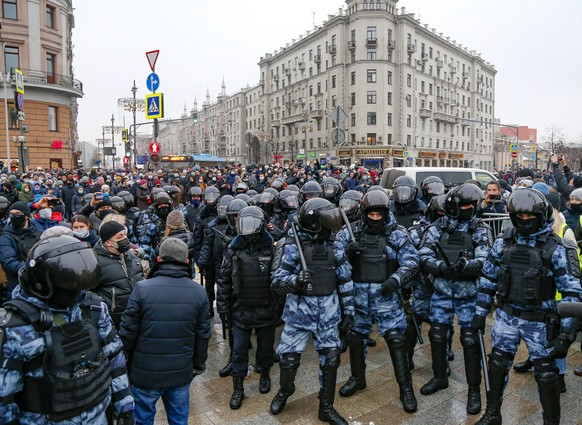 Riot police block demonstrators gathering during a protest against the jailing of opposition leader Alexei Navalny in Pushkin square in Moscow, Russia, Saturday, Jan. 23, 2021. Russian police arrested ...
