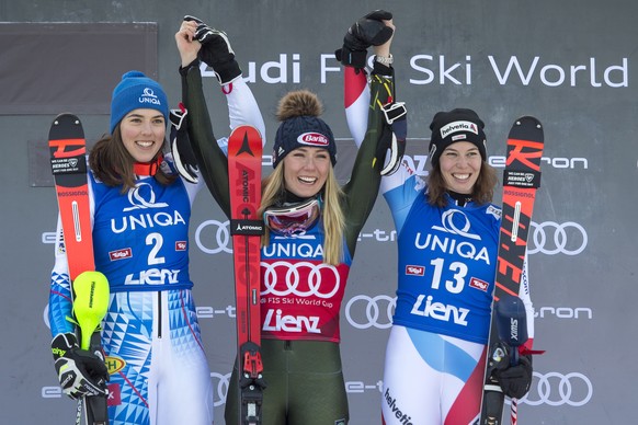 epa08093754 (L-R) Second placed Petra Vlhova of Slovakia,, winner Mikaela Shiffrin of the USA and third placed Michelle Gisin of Switzerland celebrate on the podium for the Women&#039;s Slalom race at ...