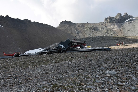 epa06928846 A handout photo made available by Cantonal Police of Grisons shows a wreckege of Junkers JU-52 aircraft after crashing on Piz Segnas above Flims, Switzerland,05 August 2018. According to r ...