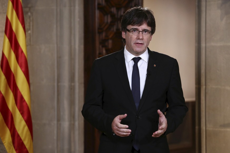 epa06244712 A handout photo made available by the Generalitat shows Catalonian President Carles Puigdemont giving a speech three days after the celebration of the Catalonian illegal referendum, at Pal ...