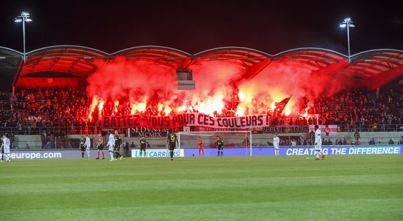 Sion&#039;s supporters light smoke flares, during the Super League soccer match of Swiss Championship between FC Sion and Grasshoppers Club, at the Stade de Tourbillon stadium, in Sion, Switzerland, S ...