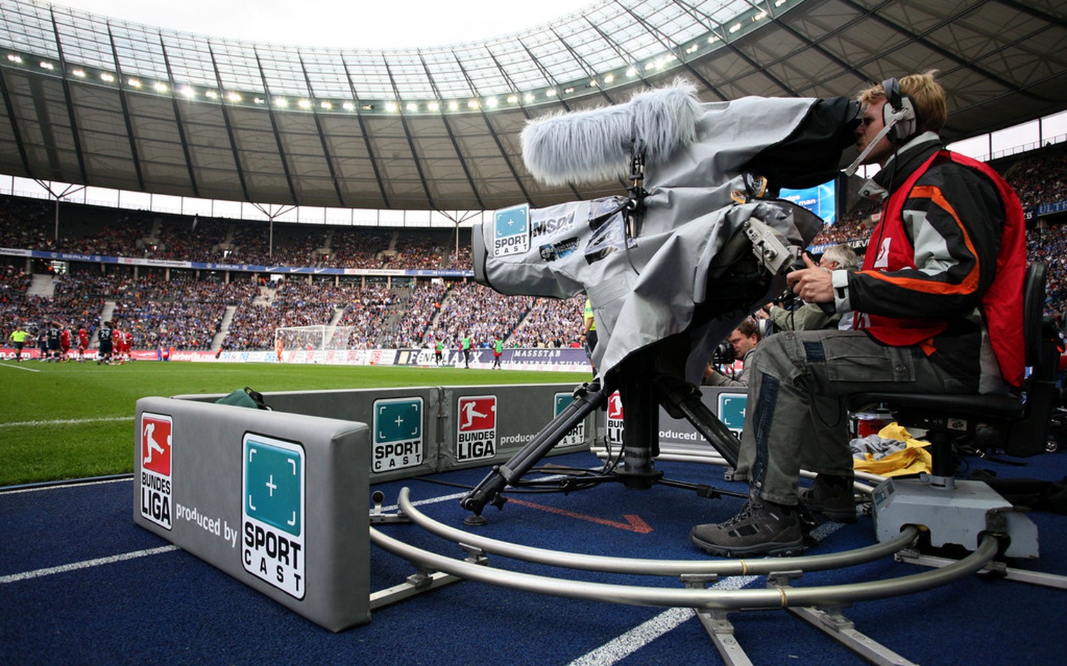 A cameraman is pictured during the German first division Bundesliga soccer match between Hertha BSC Berlin and FC Energie Cottbus in Berlin, Germany, on Saturday, Oct. 6, 2007. (AP Photo/Miguel Villag ...