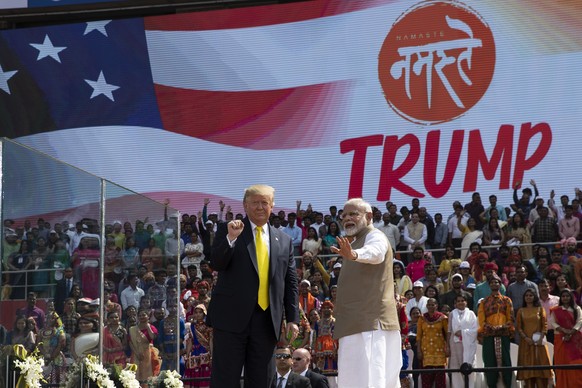 U.S. President Donald Trump and Indian Prime Minister Narendra Modi wave after a &quot;Namaste Trump,&quot; event at Sardar Patel Gujarat Stadium, Monday, Feb. 24, 2020, in Ahmedabad, India. India pou ...
