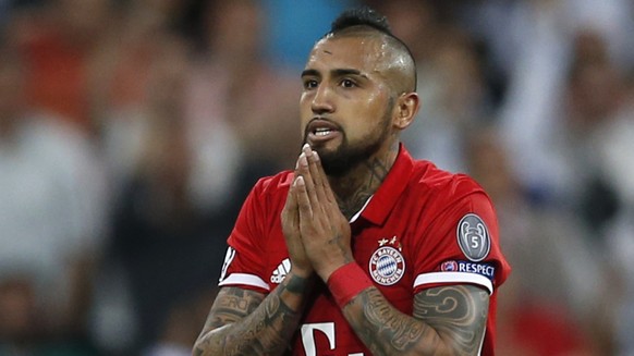 Bayern&#039;s Arturo Vidal gestures after being shown a red card during the Champions League quarterfinal second leg soccer match between Real Madrid and Bayern Munich at Santiago Bernabeu stadium in  ...