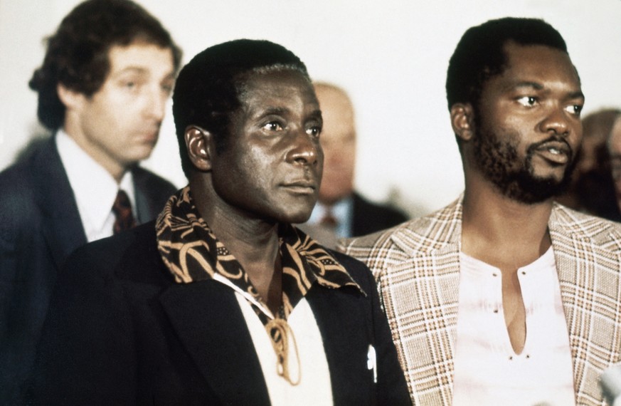 Robert Mugabe, leader of a group of African nationalists who are demanding a transfer of power to black Africans in Rhodesia in October 1976, arrives to take part in a conference on the future of Rhod ...