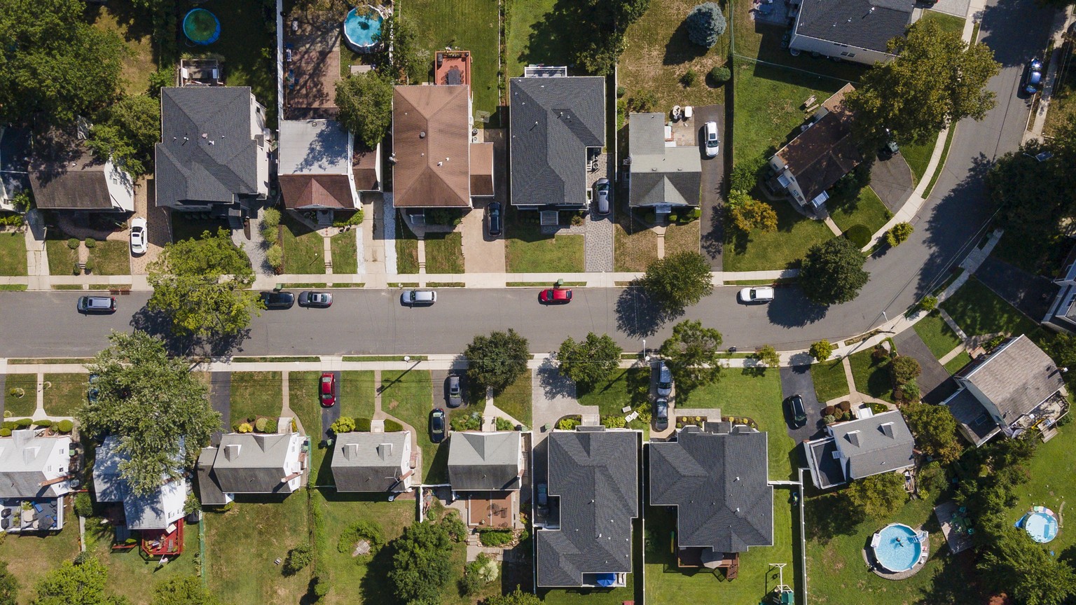 epa08633040 A photo made with a drone shows suburban houses in Paramus, New Jersey, USA, 28 August 2020. United States President Donald J. Trump has been targeting suburban voters in his re-election c ...