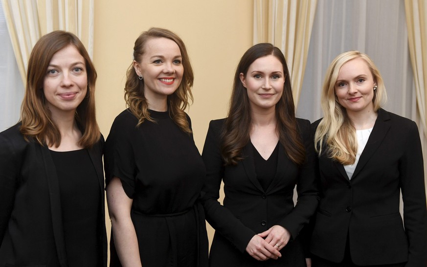 The new Prime Minister of Finland Sanna Marin, 2nd right, with Minister of Education Li Andersson, left, Minister of Finance Katri Kulmuni, 2nd left, and Minister of Interior Maria Ohisalo, right, aft ...