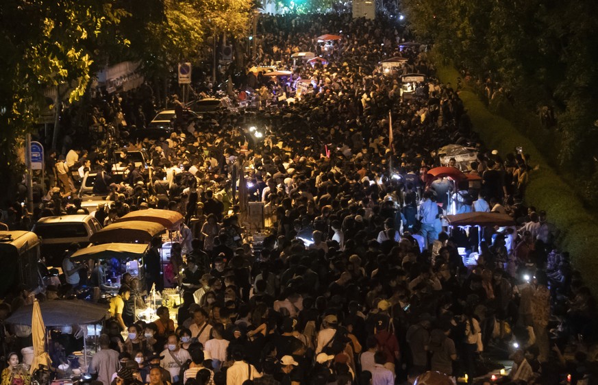 Thousands of pro-democracy protesters rally into the evening outside the Government House in Bangkok, Thailand, Wednesday, Oct. 14, 2020. Thousands of anti-government protesters gathered Wednesday for ...