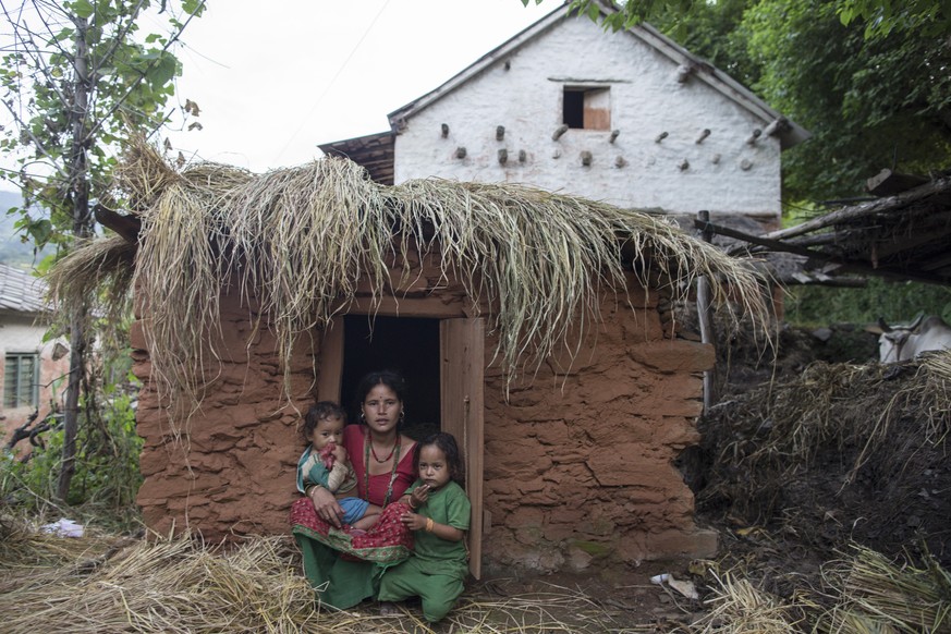 epa07308061 (FILE) - Naru Saud, aged 21, sits in a &#039;Chaupadi&#039; shed with her two-year-old son in Biraltoli village in Acham district, Nepal, 19 September 2017 (issued 22 January 2019). &#039; ...