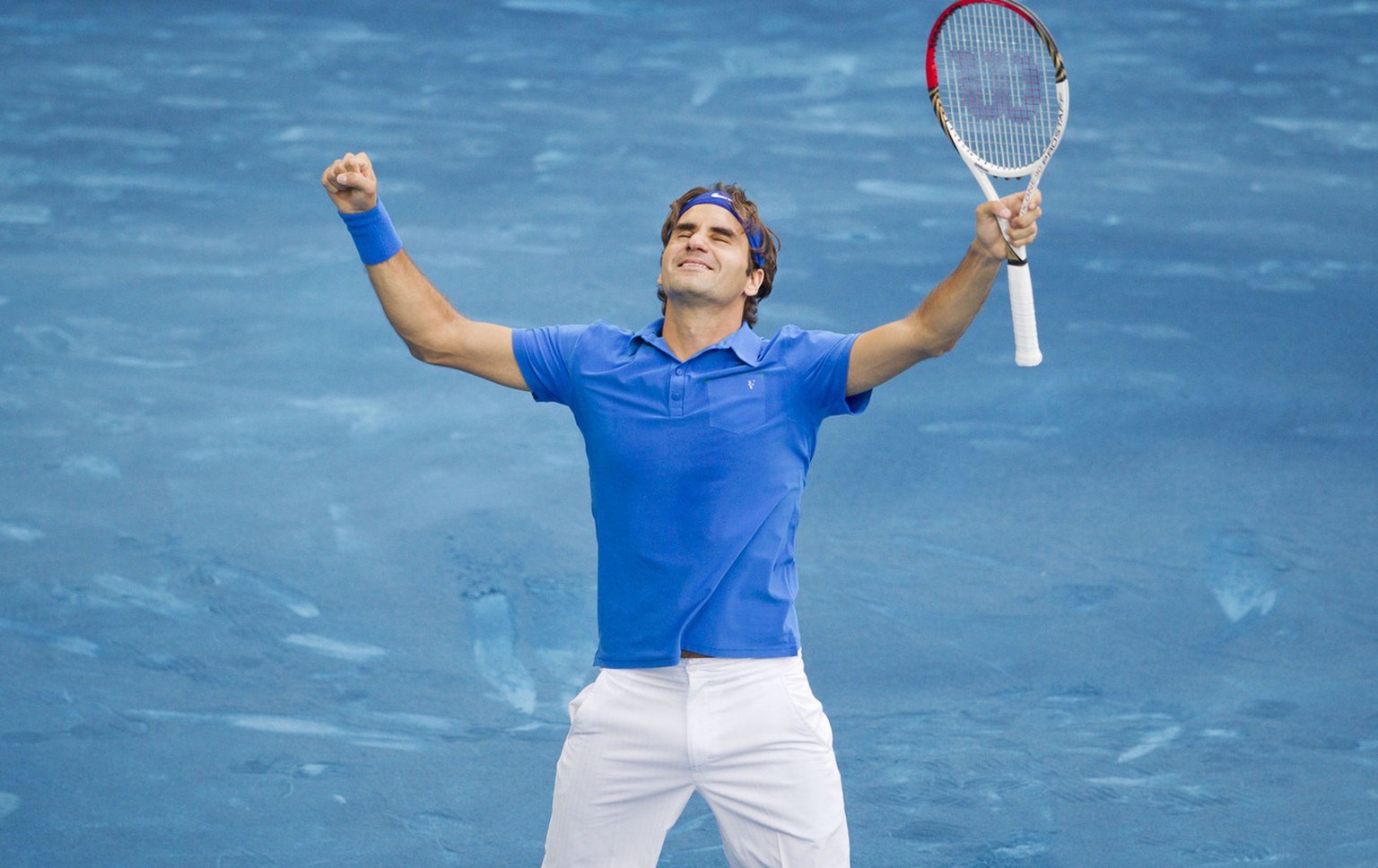 Roger Federer from Switzerland celebrates after defeating Tomas Berdych from the Czech Republic during their singles men&#039;s final tennis match at the Madrid Open tennis tournament in Madrid Sunday ...