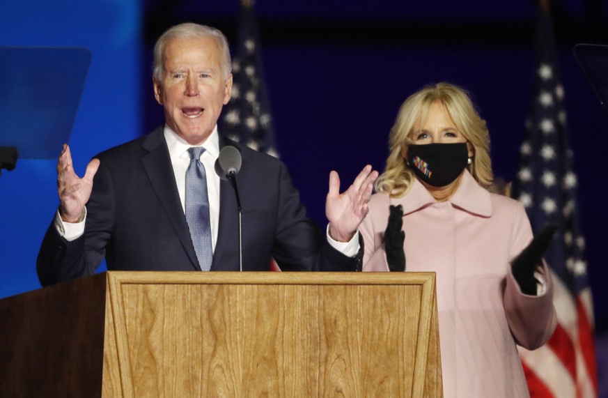 epa08797579 Democratic Candidate and former Vice President Joe Biden (L) speaks with Dr. Jill Biden at his Election Night event at the Chase Center in Wilmington, Delaware, USA, 03 November 2020. Amer ...