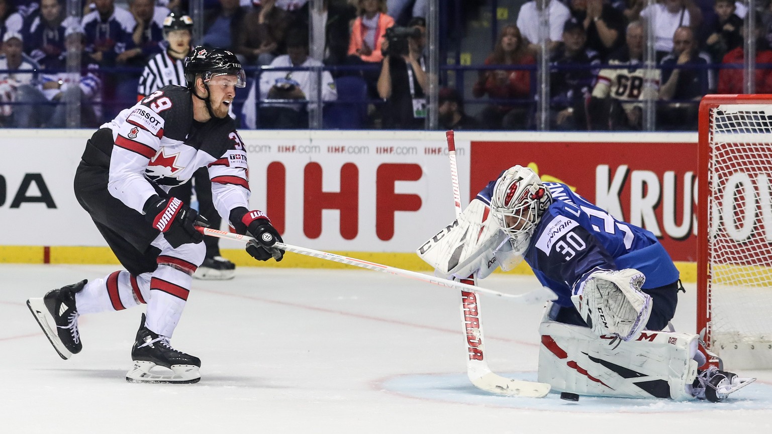 epa07561278 Anthony Mantha of Canada (L) in action against goalkeeper Kevin Lankinen of Finland (R) during the IIHF World Championship group A ice hockey match between Finland and Canada at the Steel  ...