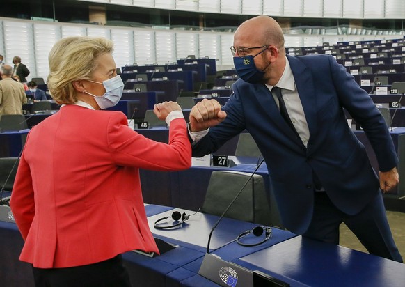 European Commission President Ursula von der Leyen greets European Council President Charles Michel during the plenary session of the European Parliament in Strasbourg, eastern France, Wednesday June  ...