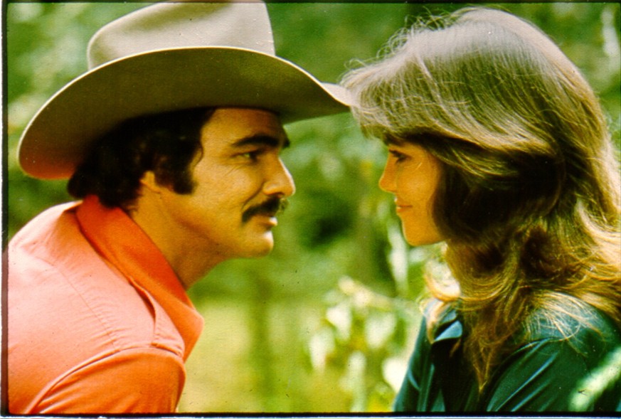 1977: Actors Burt Reynolds and Sally Field in the film &#039;Smokey and the Bandit&#039;. (Photo by Michael Ochs Archives/Getty Images)